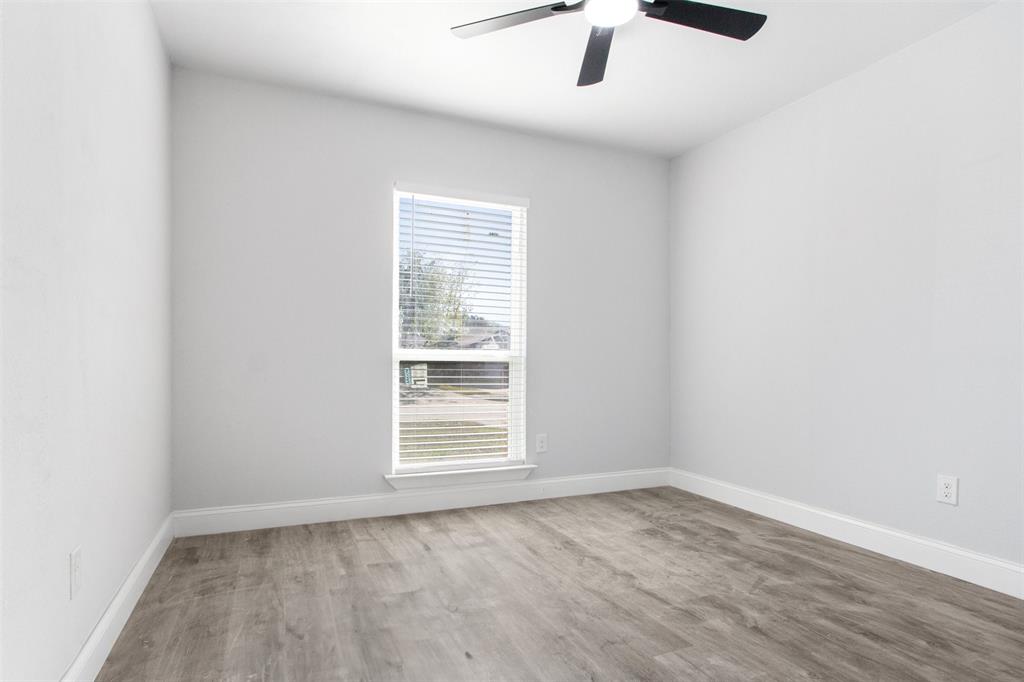 5405 Ramsey Drive The Colony, TX 75056 - Photo 26 of 32 an empty room with a empty space and a window