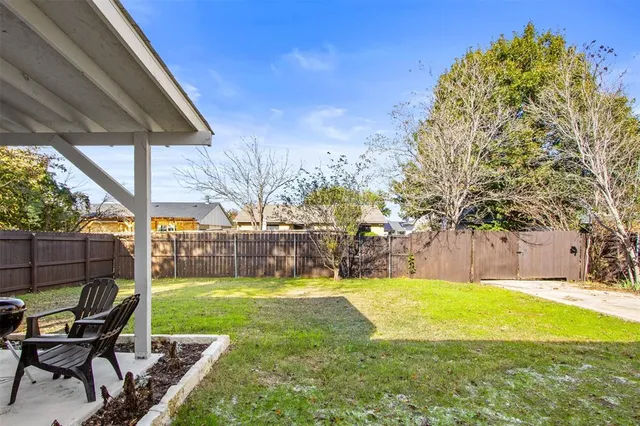 a view of a swimming pool with a sitting area
