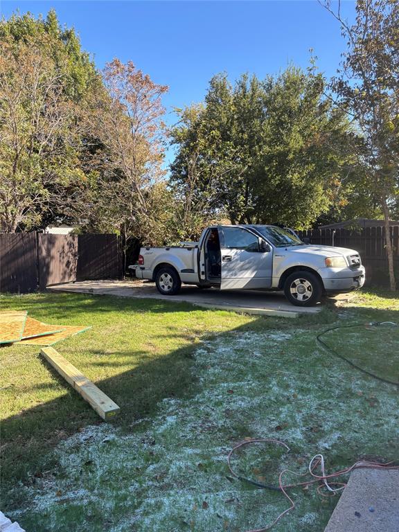 5405 Ramsey Drive The Colony, TX 75056 - Photo 31 of 32 a view of a house with pool and trees in the background