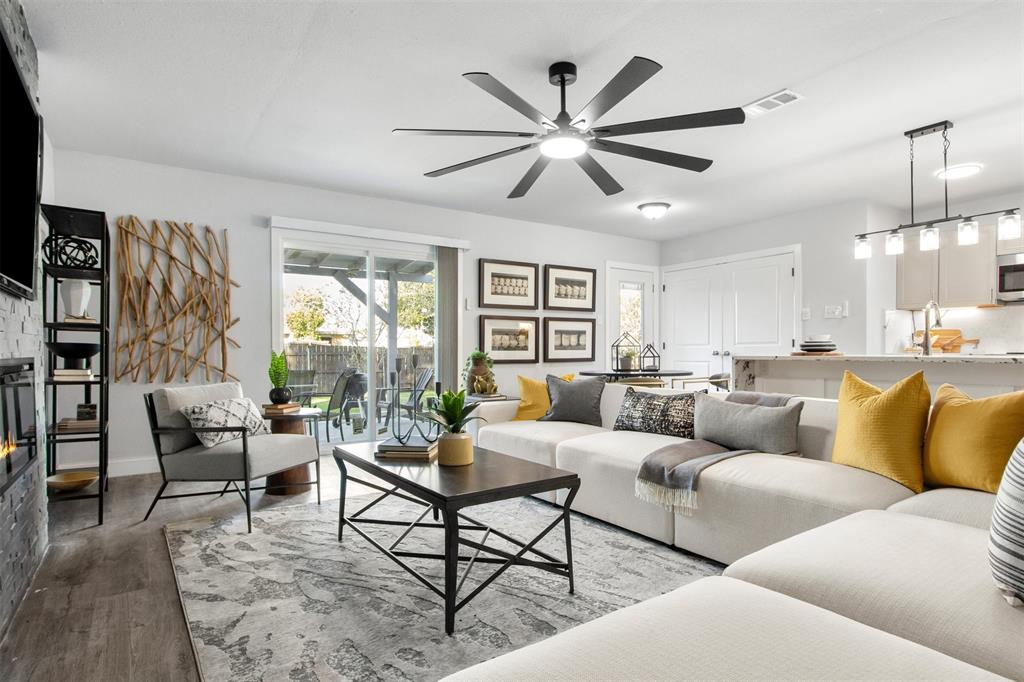 5405 Ramsey Drive The Colony, TX 75056 - Photo 6 of 32 a living room with furniture and a large window