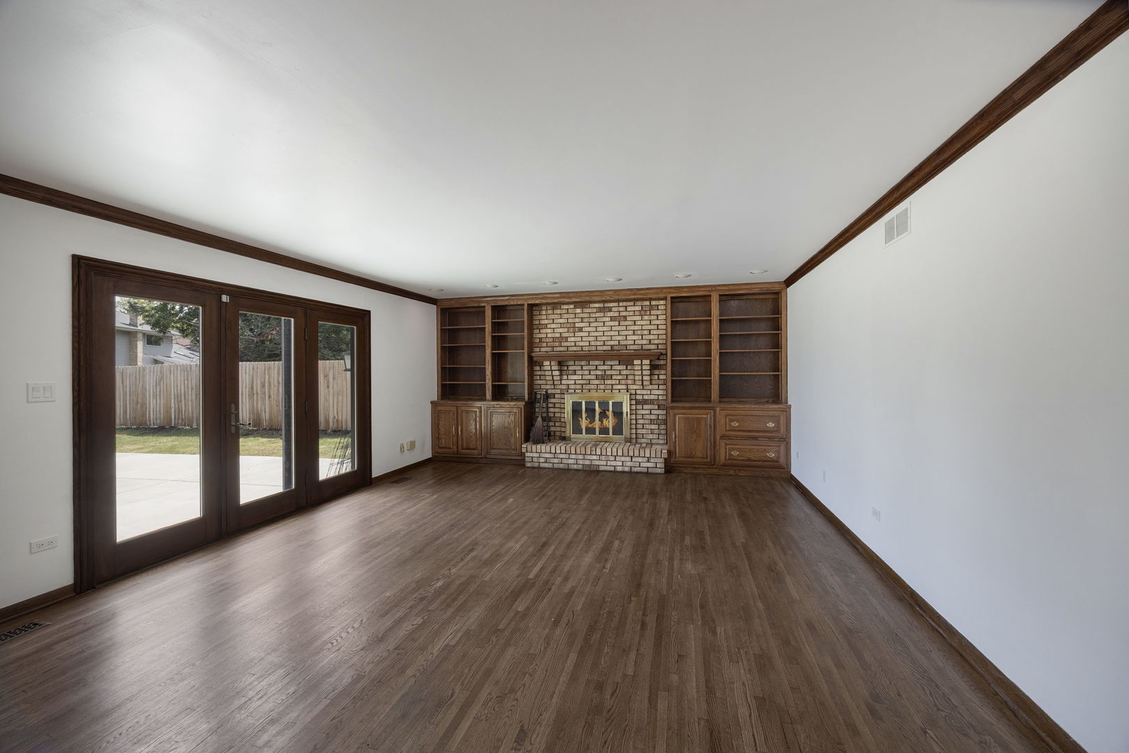 6723 Kingswood Road Willowbrook, IL 60527 - Photo 20 of 51 wooden floor in an empty room with a window