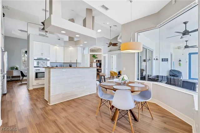 a view of a dining room with furniture and wooden floor