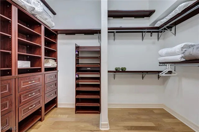 a view of walk in closet and stairs