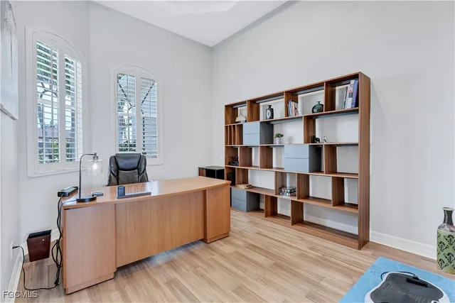 a kitchen with white cabinets and appliances