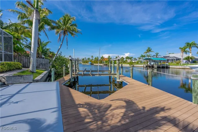 a view of a house with a backyard porch and sitting area