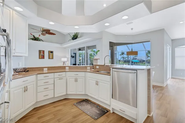 a spacious bathroom with a granite countertop sink and a mirror