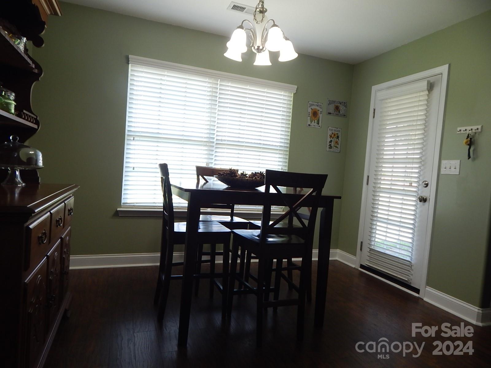 300 Ashmont Drive Kannapolis, NC 28081 - Photo 12 of 42 a view of a dining room with furniture window and wooden floor