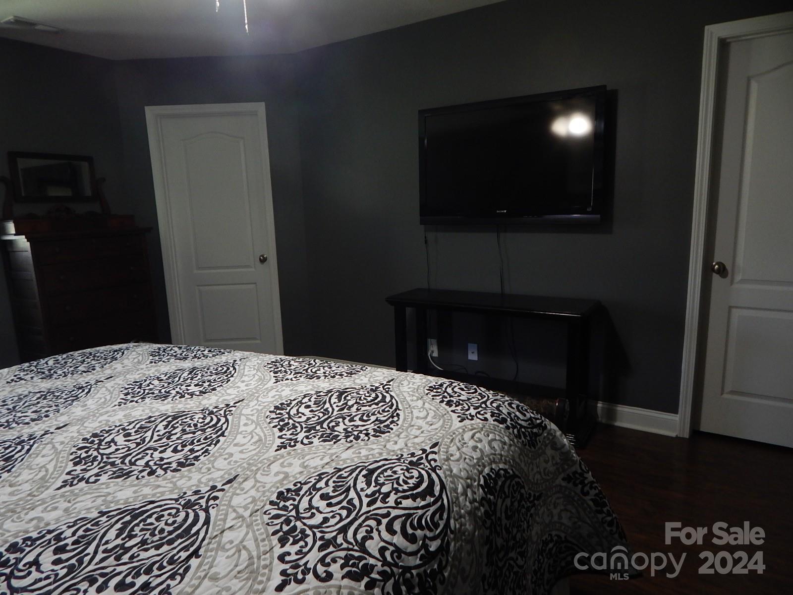 300 Ashmont Drive Kannapolis, NC 28081 - Photo 17 of 42 a bedroom with a bed and a television