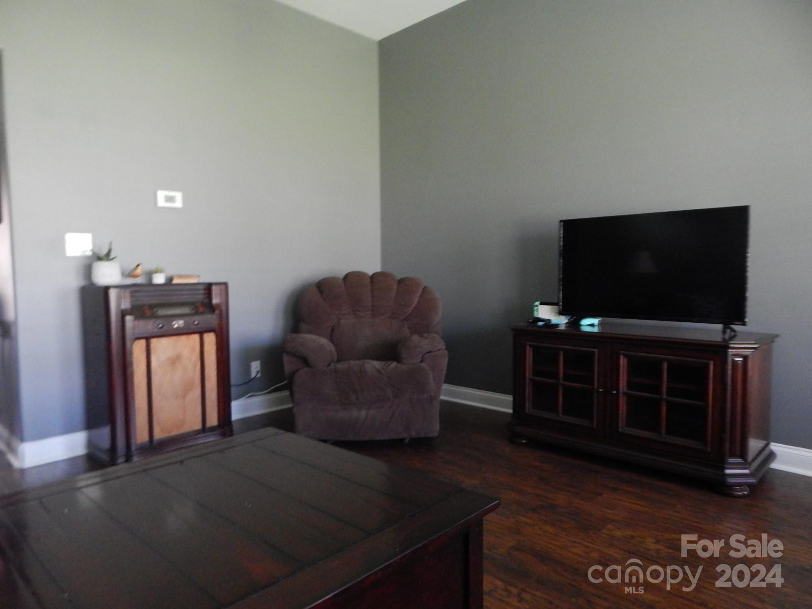 300 Ashmont Drive Kannapolis, NC 28081 - Photo 21 of 42 a living room with furniture and a flat screen tv
