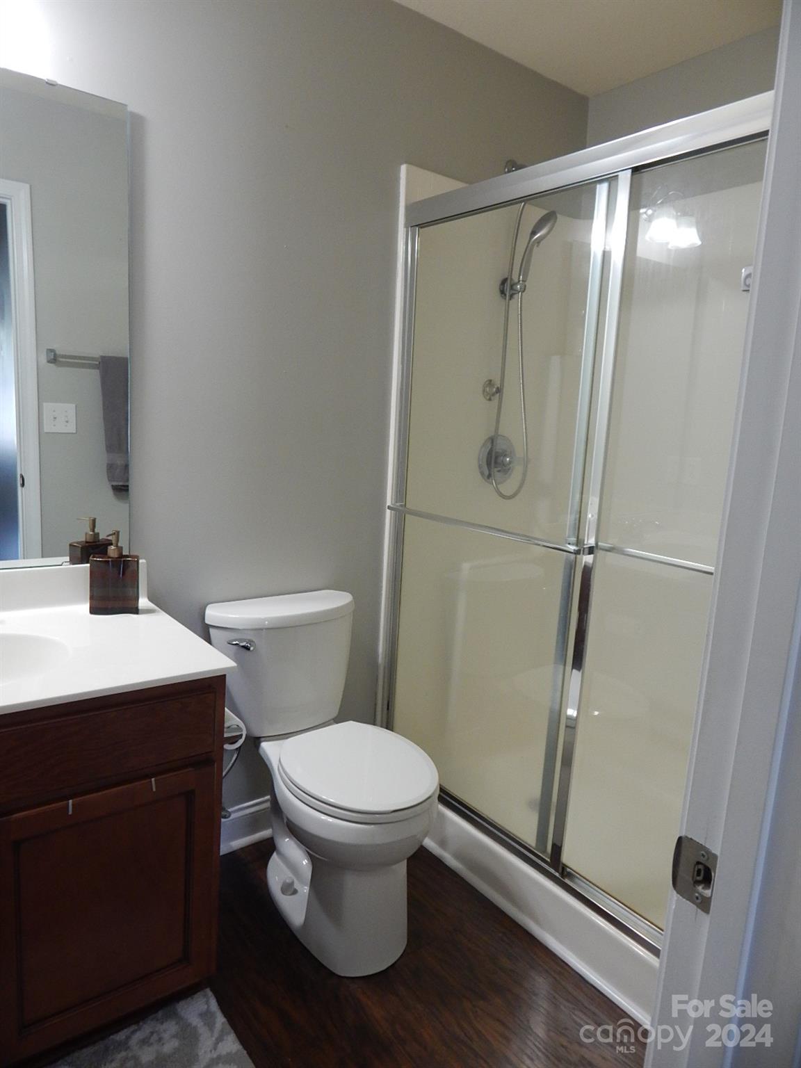 300 Ashmont Drive Kannapolis, NC 28081 - Photo 29 of 42 a white toilet sitting next to a bathroom sink