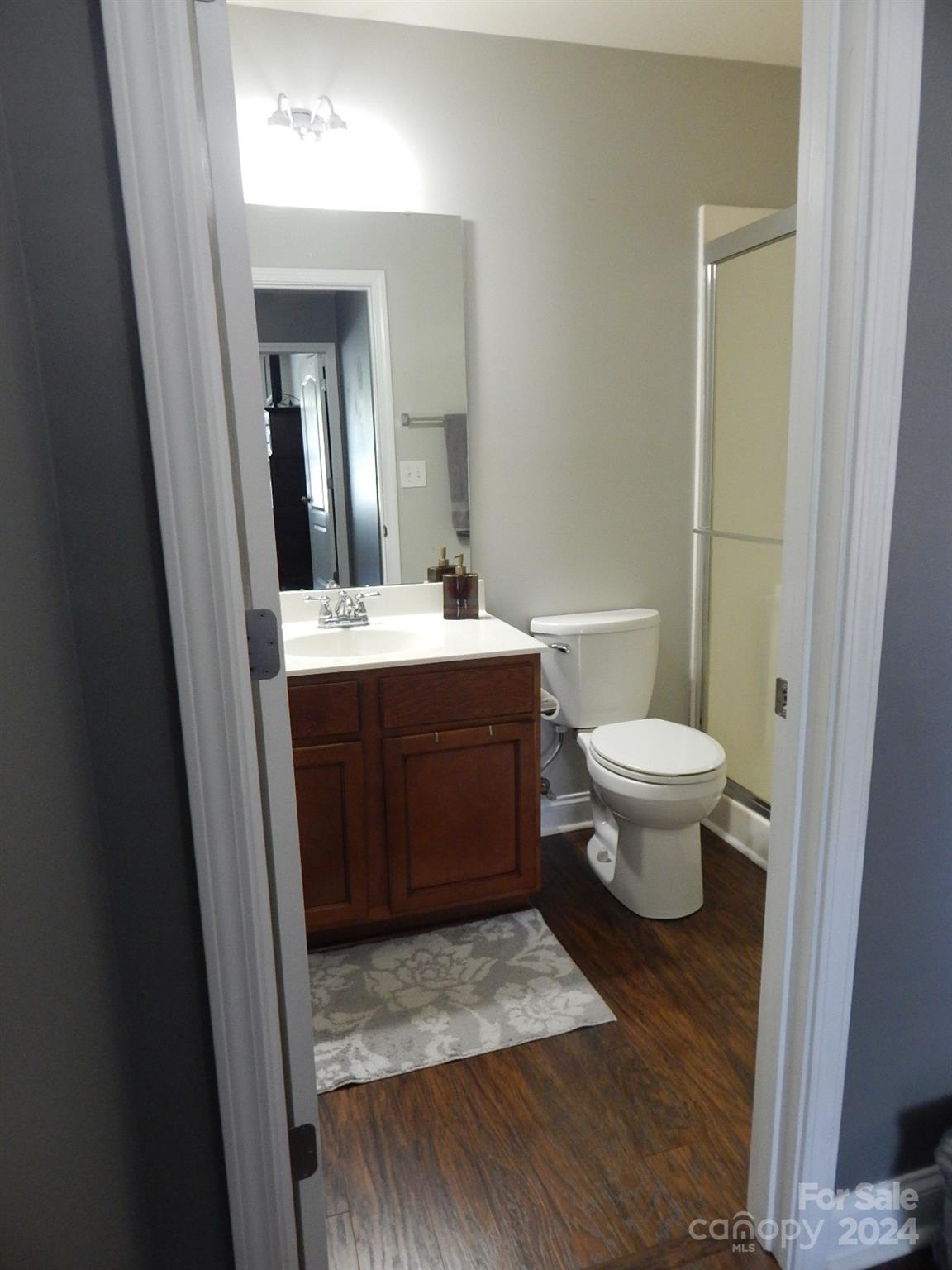 300 Ashmont Drive Kannapolis, NC 28081 - Photo 30 of 42 a bathroom with a sink toilet a mirror and vanity