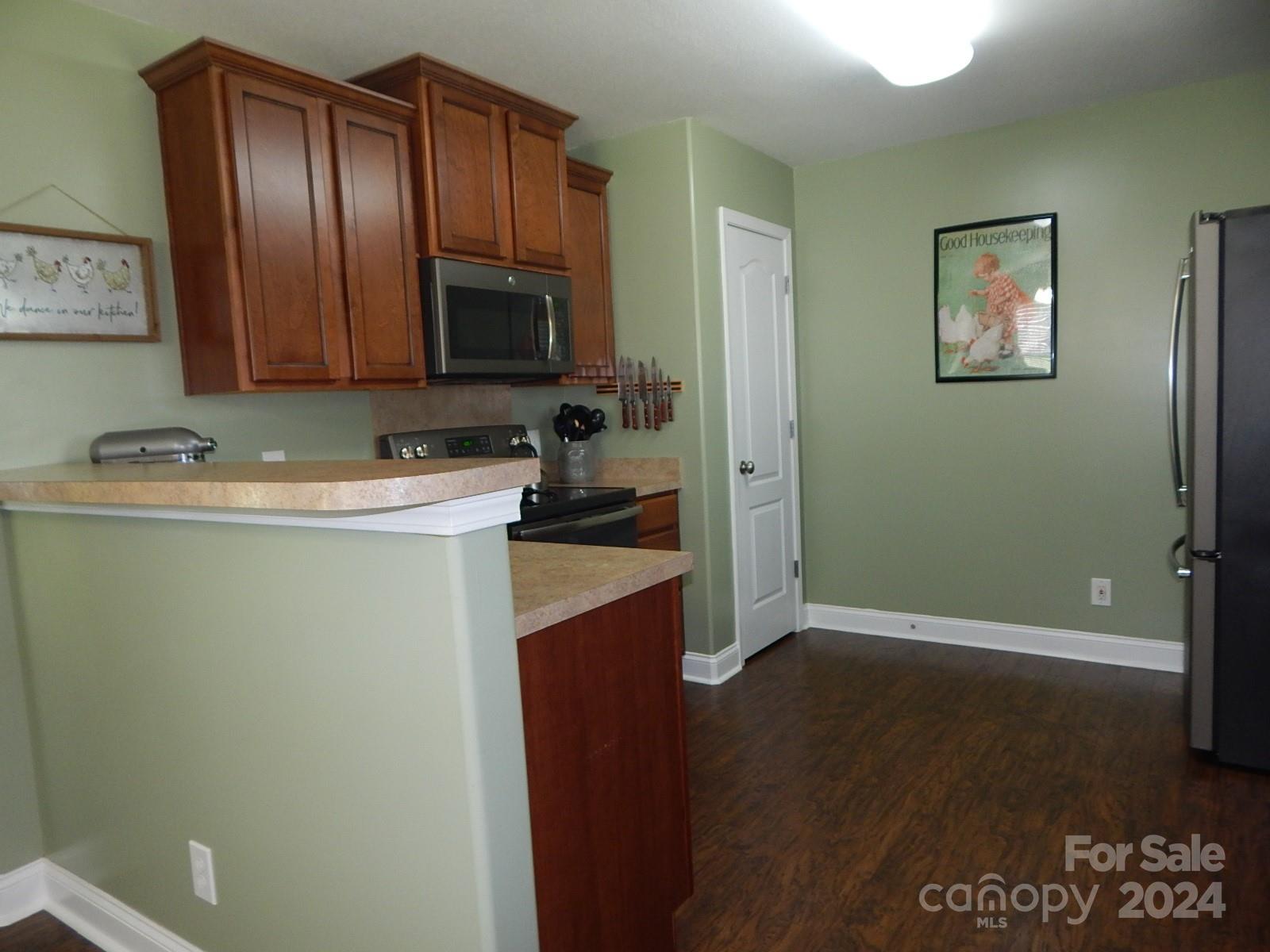 300 Ashmont Drive Kannapolis, NC 28081 - Photo 8 of 42 a kitchen with a refrigerator and a sink