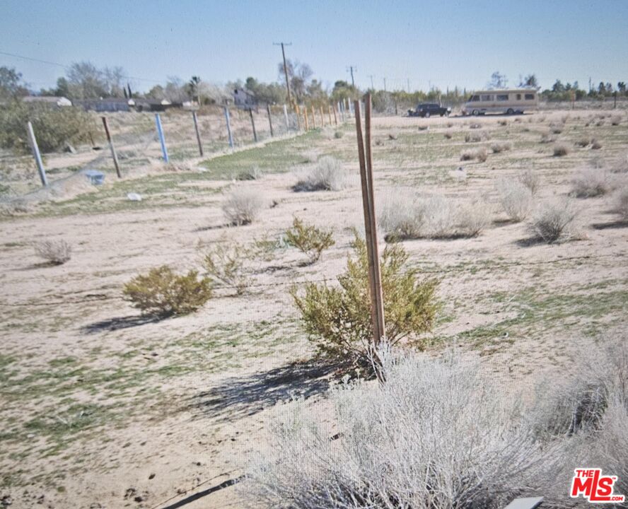 0 East Vac/vic Avenue, Unit W8/128 Pearblossom, CA 93553 - Photo 10 of 11 a view of a dry yard with wooden fence