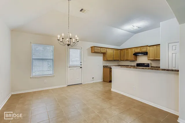 a view of a kitchen with a sink and cabinets