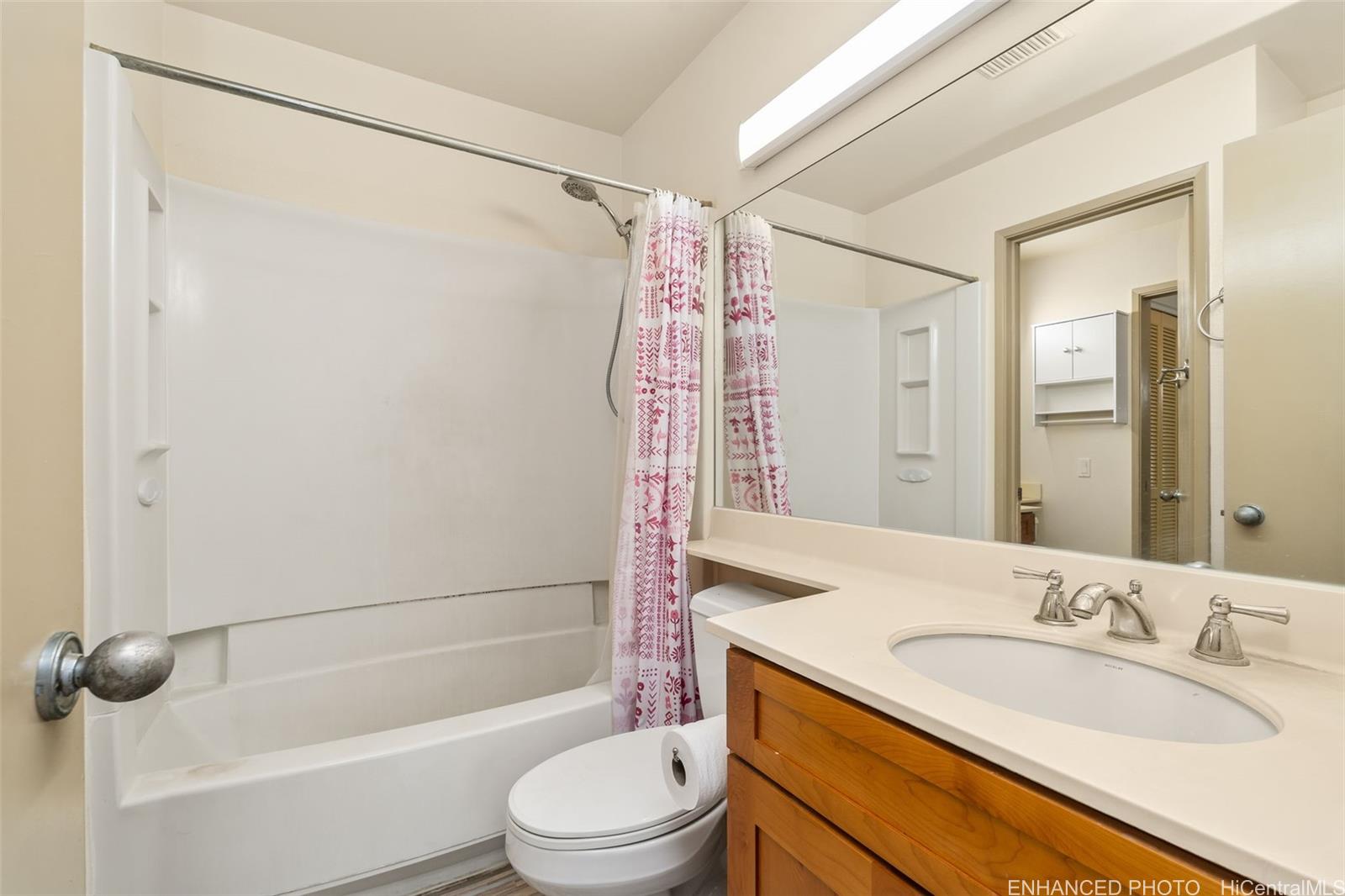 91-1119 Mikohu Street, Unit 28S Ewa Beach, HI 96706 - Photo 11 of 19 a bathroom with a sink toilet and shower
