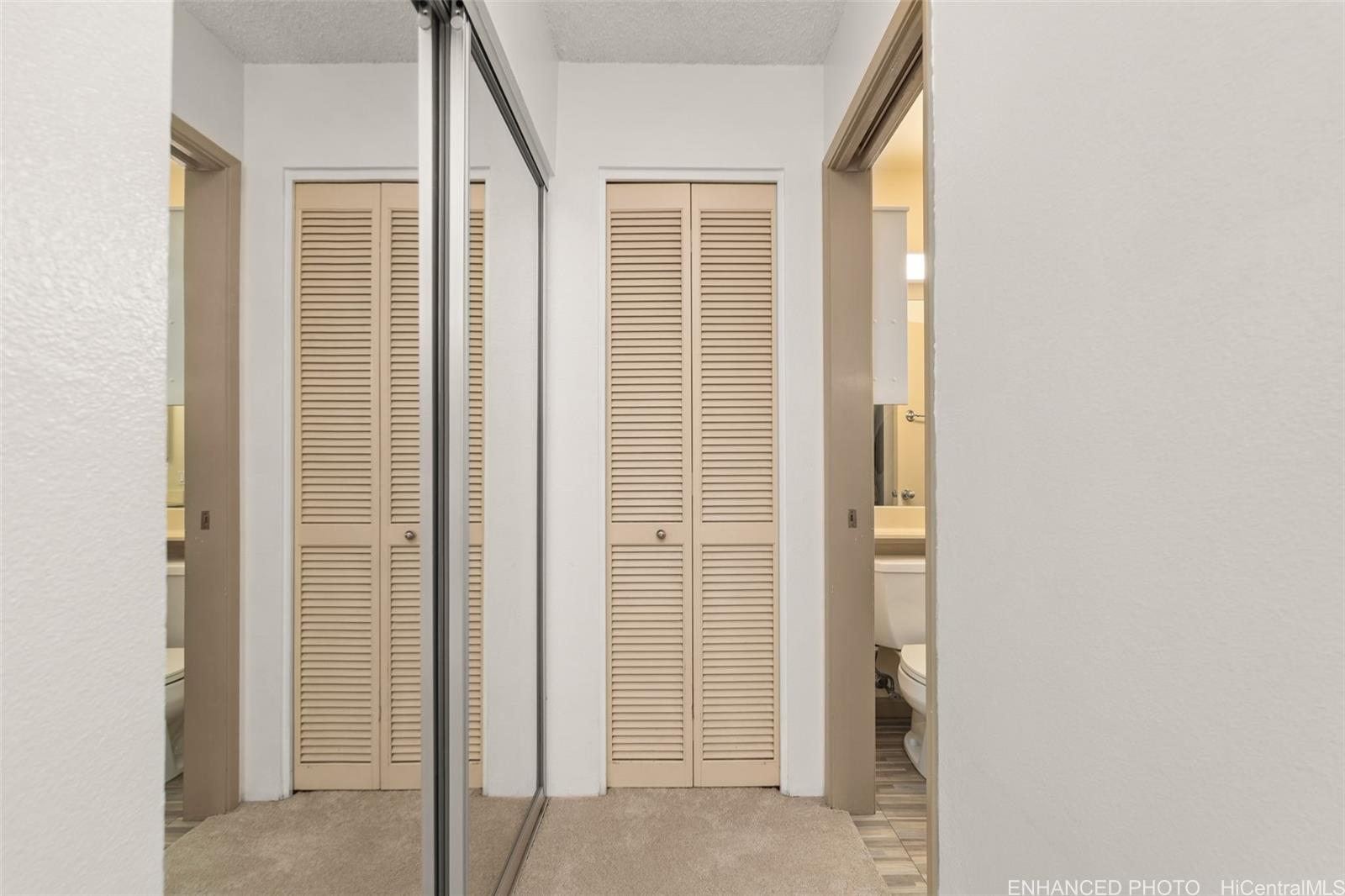 91-1119 Mikohu Street, Unit 28S Ewa Beach, HI 96706 - Photo 14 of 19 a view of a bathroom from a corridor