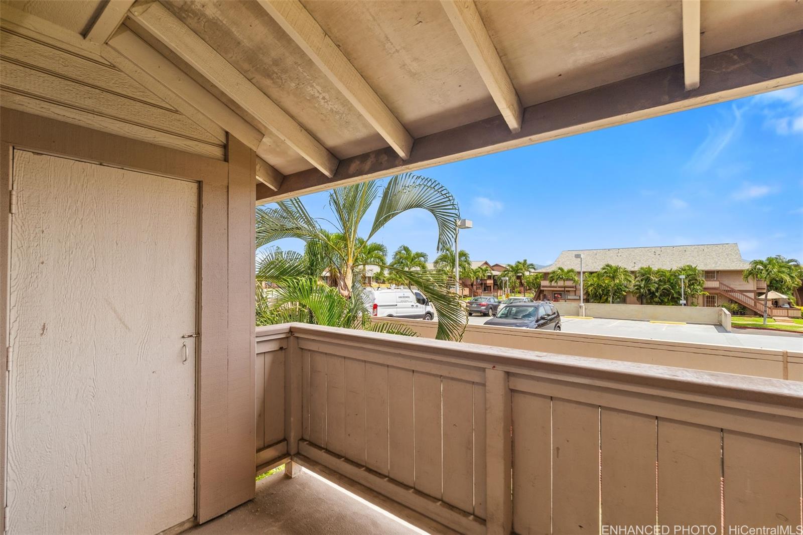 91-1119 Mikohu Street, Unit 28S Ewa Beach, HI 96706 - Photo 17 of 19 a view of a balcony with an outdoor space