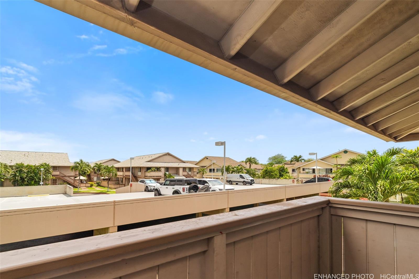 91-1119 Mikohu Street, Unit 28S Ewa Beach, HI 96706 - Photo 18 of 19 a view of a city from a balcony