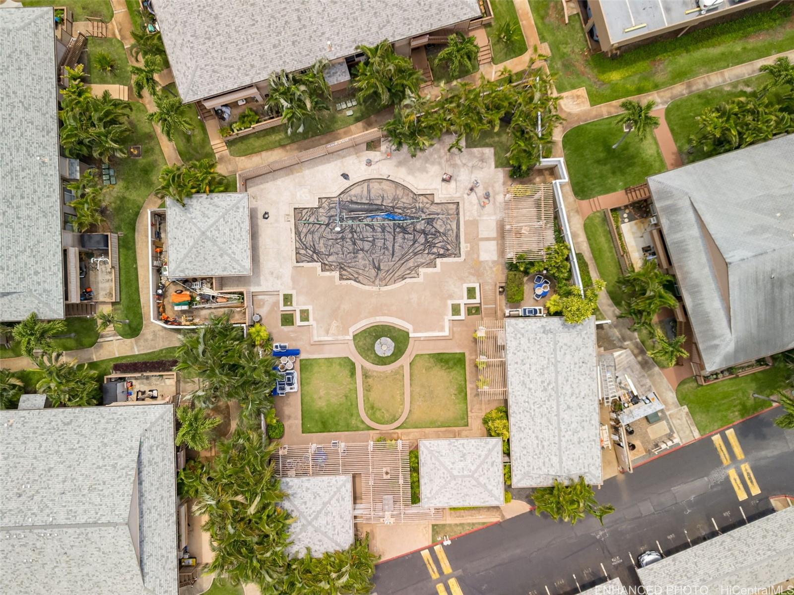 91-1119 Mikohu Street, Unit 28S Ewa Beach, HI 96706 - Photo 19 of 19 an aerial view of a house with a garden and parking