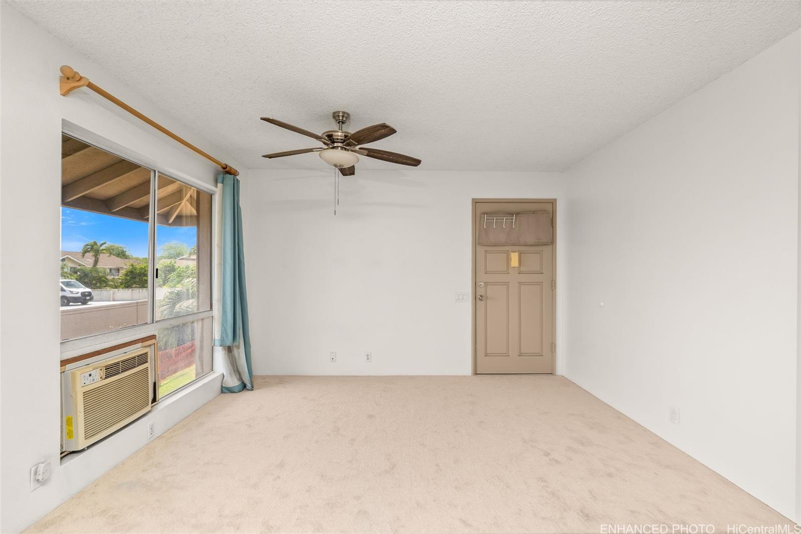 91-1119 Mikohu Street, Unit 28S Ewa Beach, HI 96706 - Photo 2 of 19 a view of an empty room and a window