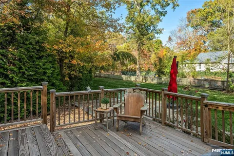 a view of balcony with wooden floor and outdoor seating