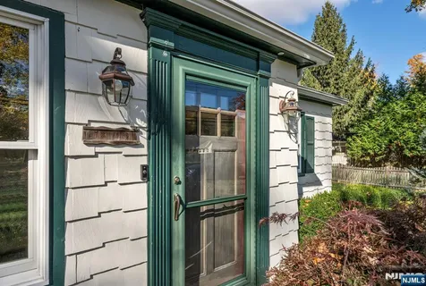 a living room with furniture fireplace and a large window