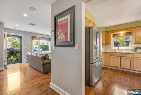 a kitchen with stainless steel appliances granite countertop a sink and a stove