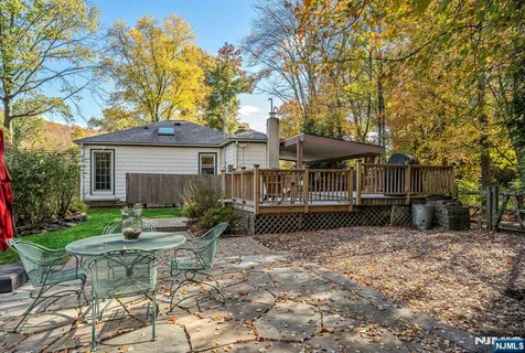 a view of a field of grass and trees
