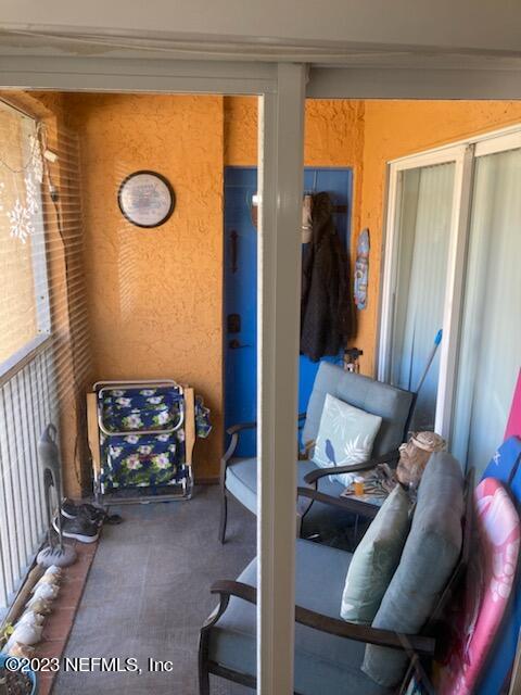 201 25th Avenue South, Unit N32 Jacksonville Beach, FL 32250 - Photo 12 of 38 a view of living room with furniture and a rug