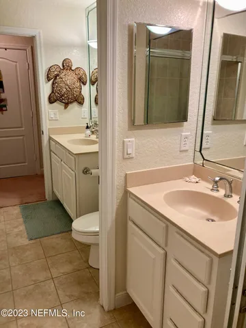 a bathroom with a toilet and a sink