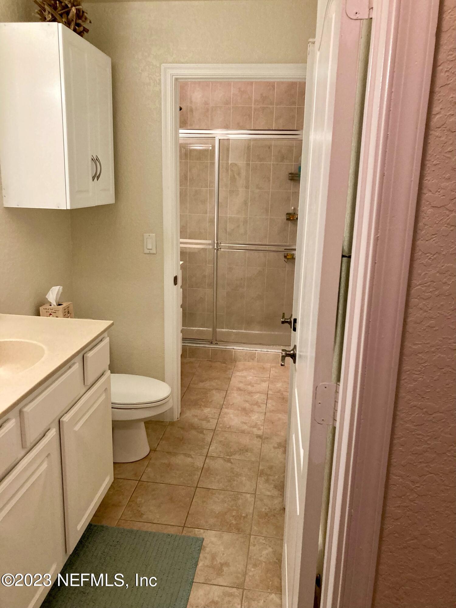 201 25th Avenue South, Unit N32 Jacksonville Beach, FL 32250 - Photo 19 of 38 a bathroom with a toilet and a sink