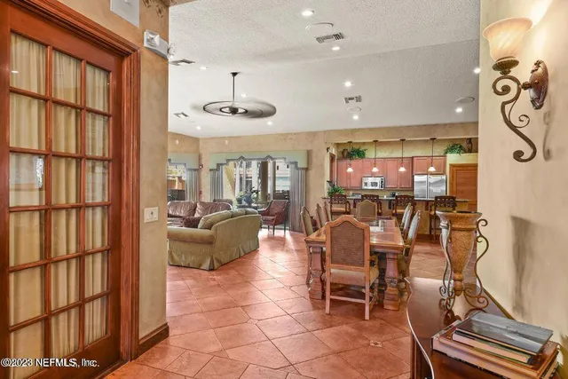 a large kitchen with a table and chairs