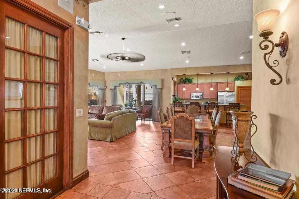 201 25th Avenue South, Unit N32 Jacksonville Beach, FL 32250 - Photo 27 of 38 a dining room with furniture and a window