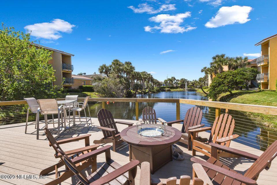 201 25th Avenue South, Unit N32 Jacksonville Beach, FL 32250 - Photo 30 of 38 a view of a balcony with chairs and wooden floor