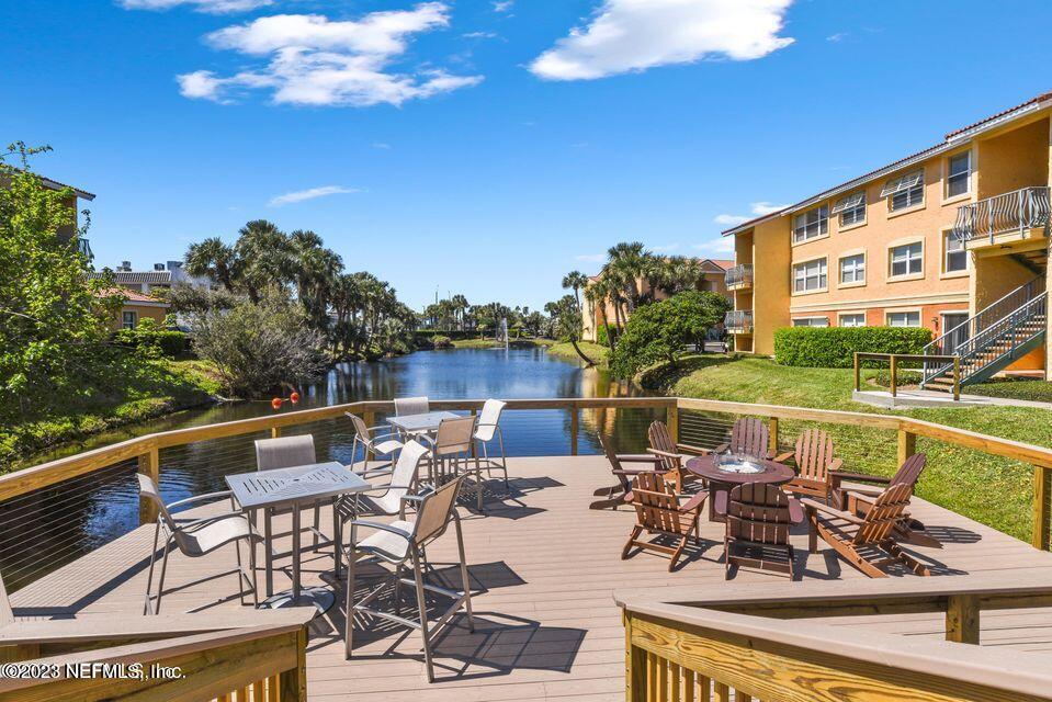 201 25th Avenue South, Unit N32 Jacksonville Beach, FL 32250 - Photo 31 of 38 a view of a swimming pool with outdoor seating and plants