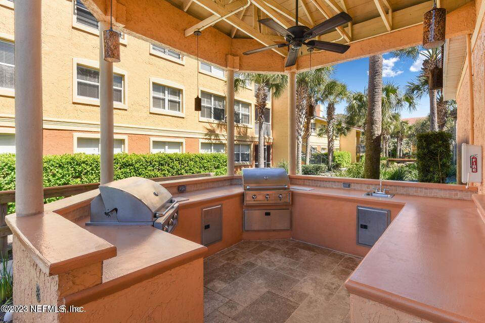 201 25th Avenue South, Unit N32 Jacksonville Beach, FL 32250 - Photo 32 of 38 a room with furniture a large window and a sink