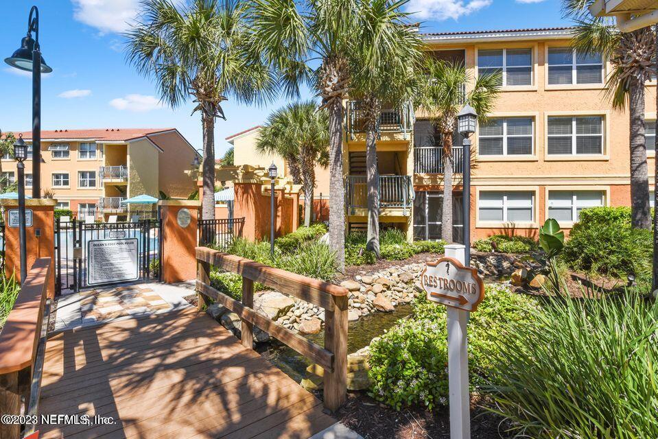 201 25th Avenue South, Unit N32 Jacksonville Beach, FL 32250 - Photo 33 of 38 a view of multiple house with a yard and potted plants