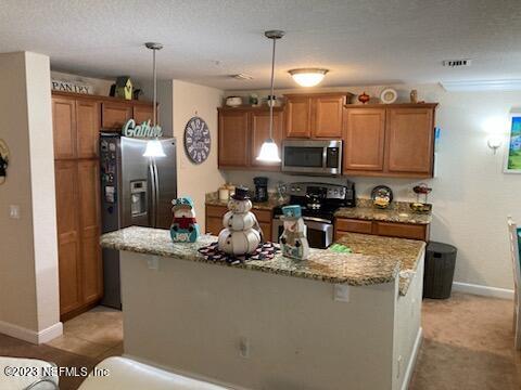 201 25th Avenue South, Unit N32 Jacksonville Beach, FL 32250 - Photo 7 of 38 a kitchen with stainless steel appliances granite countertop a sink a refrigerator and a stove