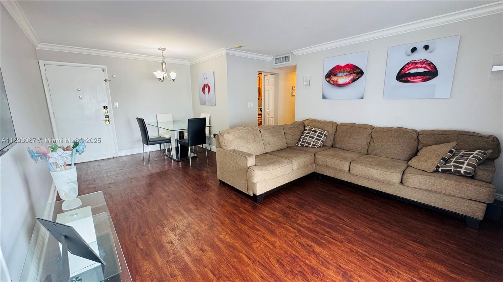 7226 Southwest 94th Place, Unit F7 Miami, FL 33173 - Photo 1 of 23 a living room with furniture and wooden floor