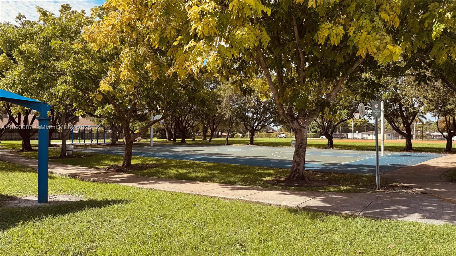 7226 Southwest 94th Place, Unit F7 Miami, FL 33173 - Photo 18 of 23 a view of yard with tree