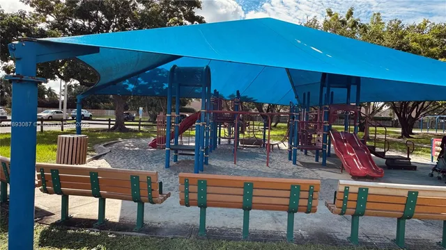 a view of a backyard with a patio and outdoor seating