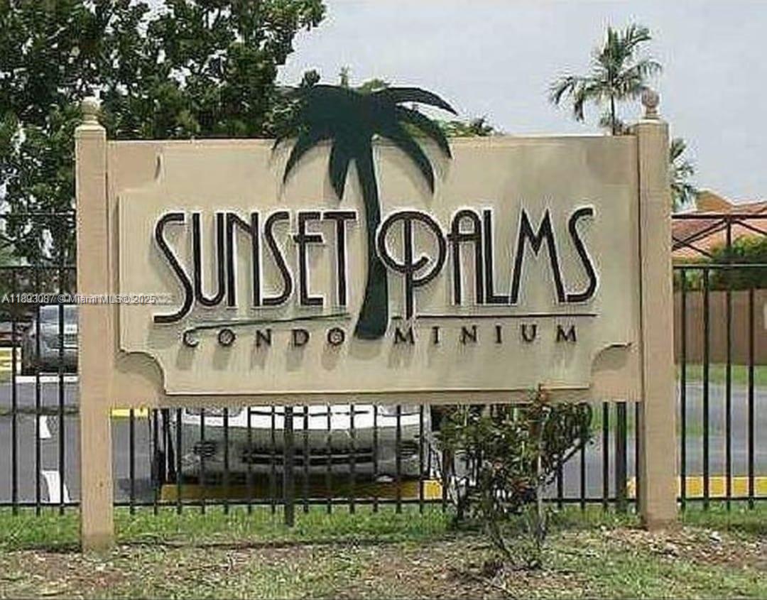 7226 Southwest 94th Place, Unit F7 Miami, FL 33173 - Photo 23 of 23 a sign on a wall next to a road