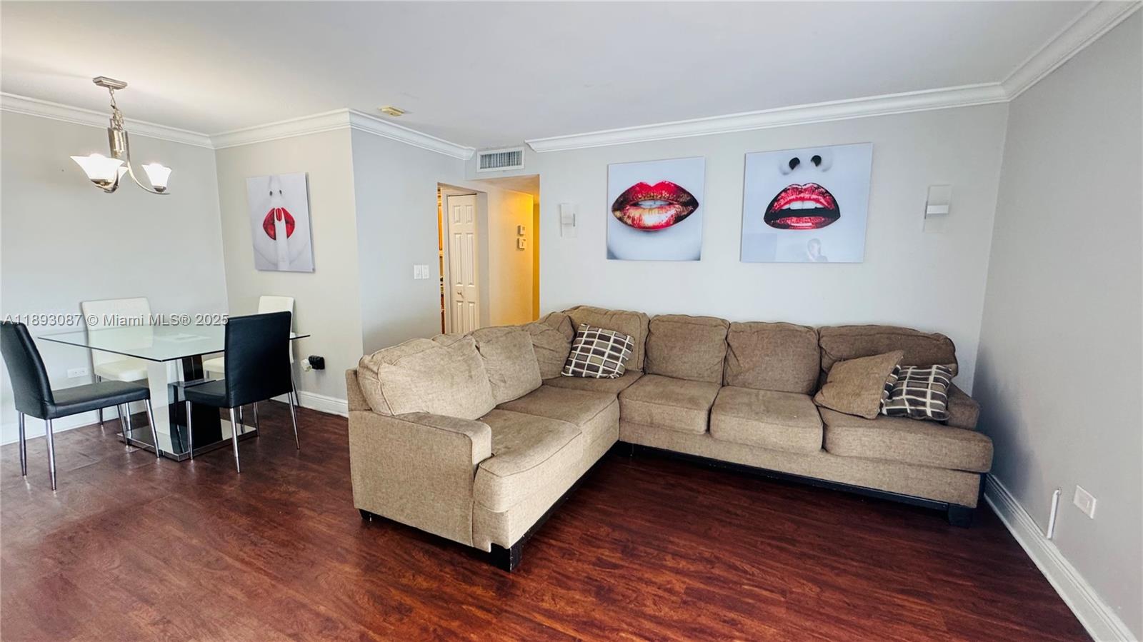 7226 Southwest 94th Place, Unit F7 Miami, FL 33173 - Photo 5 of 23 a living room with furniture and a wooden floor