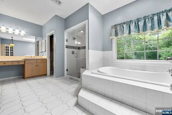 a bathroom with a bathtub and a sink