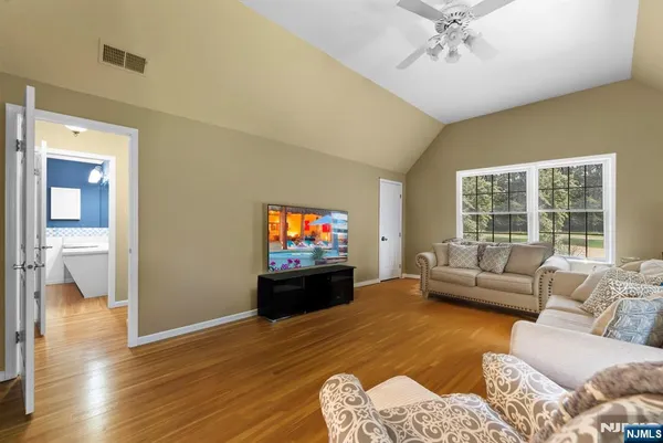 a living room with furniture and a flat screen tv