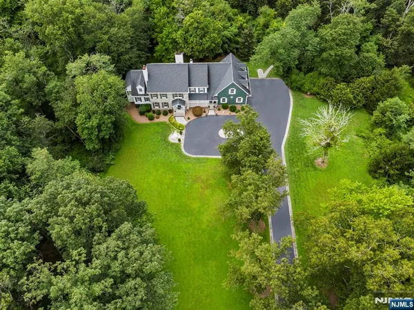 an aerial view of a house with a garden