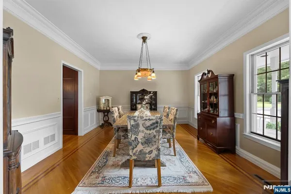 a living room with furniture dining table and a window