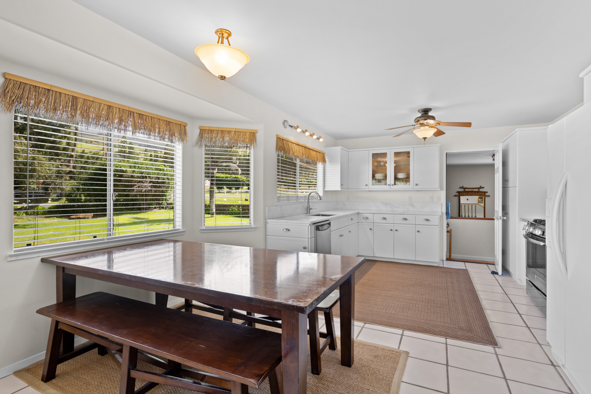 66-1685 Kohala Mountain Road Kamuela, HI 96743 - Photo 5 of 26 a living room with a table chair and a chandelier