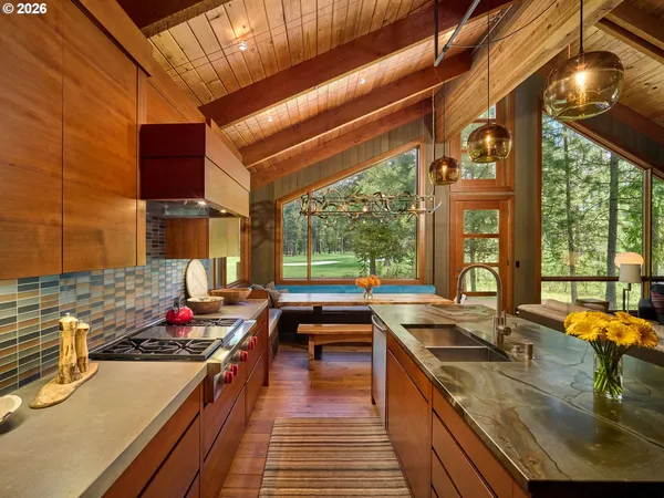 a kitchen with lots of counter top space and wooden floor