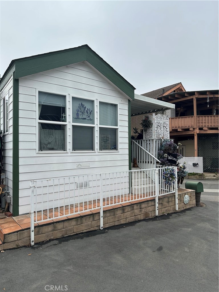 43 Riversea Road Seal Beach, CA 90740 - Photo 1 of 7 a front view of a house with glass windows